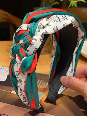 Woven Red, Green, and White headband.